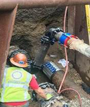 Installing pipe on Enneking Parkway